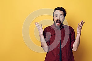 Expressive Happy Young Bearded Man Hands up