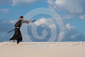 Expressive man practicing Japanese martial art