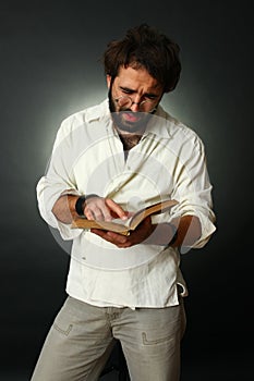 Expressive man reading a book