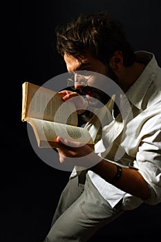 Expressive man reading a book