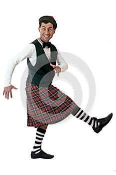 Expressive man in Scottish costume.