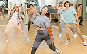 Expressive teen girl dancing krump in choreographic studio