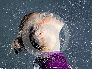 Expressive woman with falling water droplets