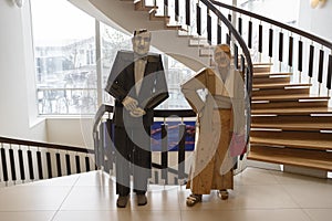 Clever wooden sculptures of people placed in hotel lobbies in Reykjavik, Iceland