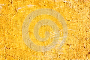 Expressive yellow brush strokes on canvas background