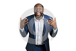 Expressively smiling businessman, white background.