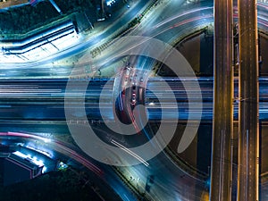 Expressway top view, Road traffic an important infrastructure, car traffic transportation above intersection road in city night