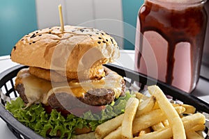 exquisite burger served with french fries photo