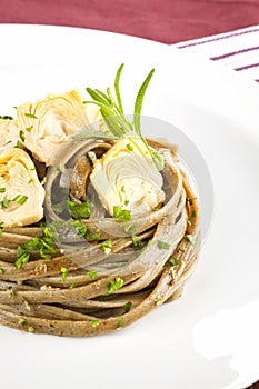 Exquisite dining. Pasta with artichoke.