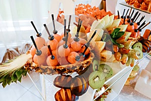 Exquisite festive table with sweets and fruits.