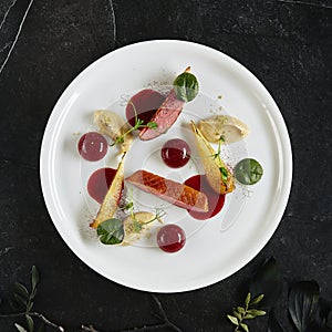 Exquisite Serving Creative Molecular Dish of Duck Breast, Baked Pear and Cherry Spheres Top View