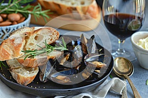 Exquisite traditional mediterranean grilled mussels served on a stylish black plate