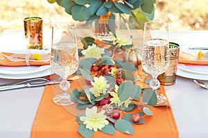 Exquisitely decorated table for two. Autumn themed table setting