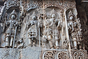 Exquisitely ornated relief carvings on outer wall of Hoysaleswara Temple