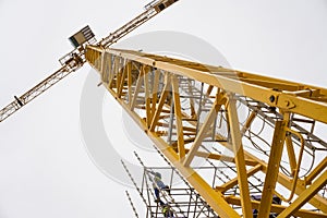 Exteme angle of yellow construction tower crane