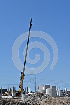 Extended boom from a crane lifting an object