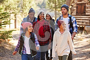 Extended Family Group On Walk Through Woods In Fall