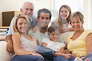 Extended family in living room smiling photo
