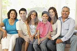 Extended Family Relaxing At Home Together