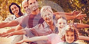 Extended family smiling in park