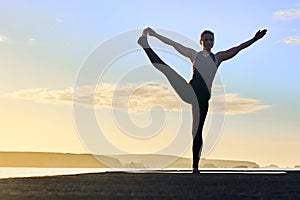 Extended Hand-to-Big-Toe Pose of young woman