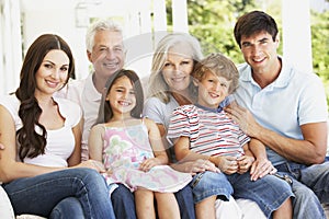 Extendend family sitting in garden