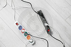 Extension cords on floor, top view. Electrician`s professional