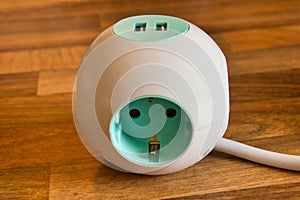 Extension Socket with USB Port on white background for charging phones and electronic devices, blue power cord