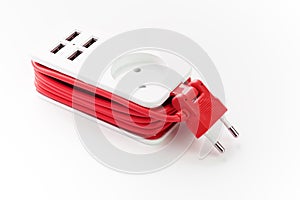 Extension Socket with USB Port on white background for charging phones and electronic devices, red power cord