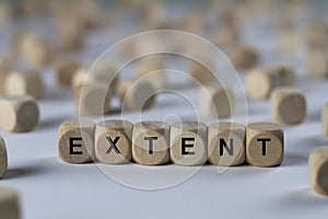 Extent - cube with letters, sign with wooden cubes