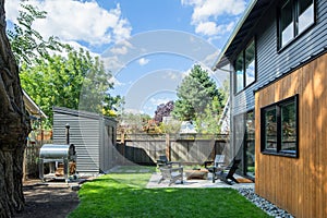 Exterior of an ADU that features a large backyard photo