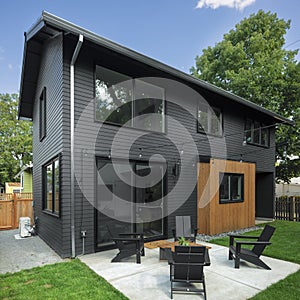 Exterior of an ADU that features a large backyard photo