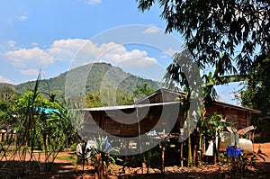 Exterior ancient wooden house or antique old wood home in Ban Taphoen Khi Karen Village top of Khao Thewada mountain in Phu Toei