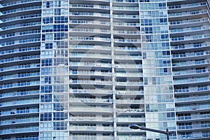 Exterior architecture of tall building with apartment homes