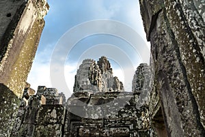 Exterior of the Bayon temple with gargantuan faces, Angkor Thom, Angkor, Cambodia