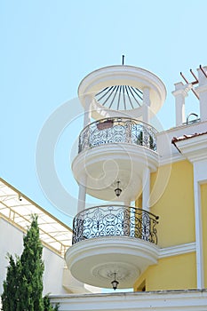 Exterior of beautiful building with balconies against blue sky, low angle view