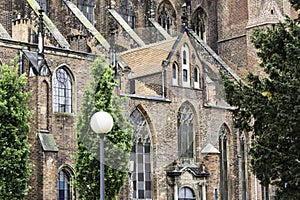 Exterior of a brick cathedral in the Gothic style.