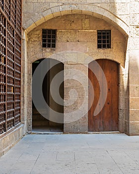 Exterior brick stone passage with two adjacent vaulted wooden grunge doors photo