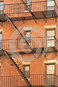 Exterior of a building with old fire escape in New York City