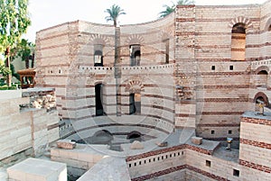 Exterior of a Coptic church in Cairo, Egypt with deep pits