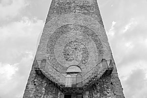 Exterior detail of antique tower building in Florence, Italy, with Escher architecture style