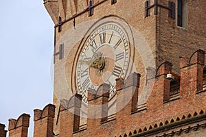 Exterior detail of the Clock Tower at Palazzo Comunale in Bologna, Italy. photo