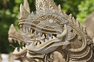 Exterior detail of the Naga (giant snake), protecting the Haw Phra Kaew temple in Vientiane, Laos.