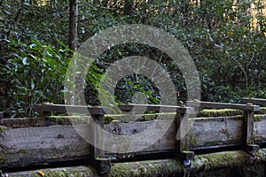 Exterior detail of an old water sluice for a mill, Appalachian scene