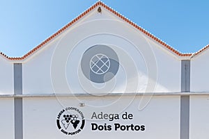 Exterior of the Dois Portos cooperative winery with its logo