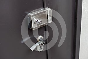 Exterior door handle and Security lock on Metal frame.