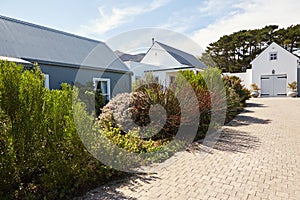 Driveway leading to a large country style home