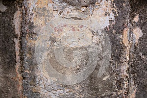 Exterior facade of an old abandoned house. Weathered and faded wall texture, background