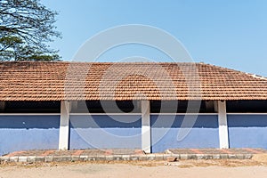 Exterior facade of an old traditional house with sloping roof