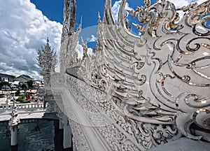 Exterior facade thai oriental ornamentation of Wat Rong Khun white Temple